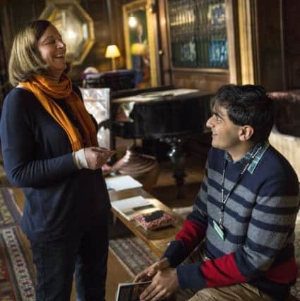 A volunteer talking to a visitor at Wightwick Manor and Gardens. Photo: National Trust. EMN-180117-125215001